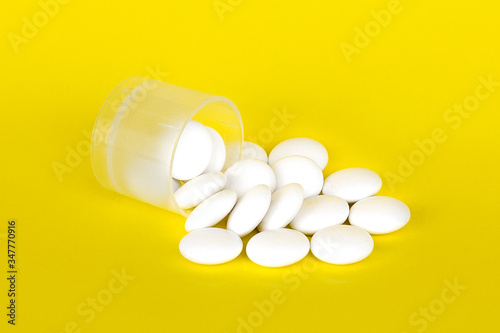 Pyramid tablets, medicines in white and black on a yellow background