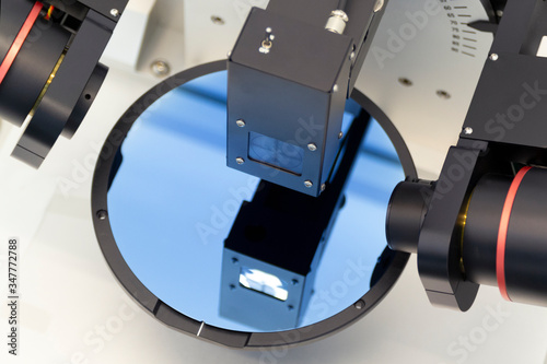 Ellipsometer tool in a laboratory. Silicon wafer of purple color measure thickness of film on ellipsometer