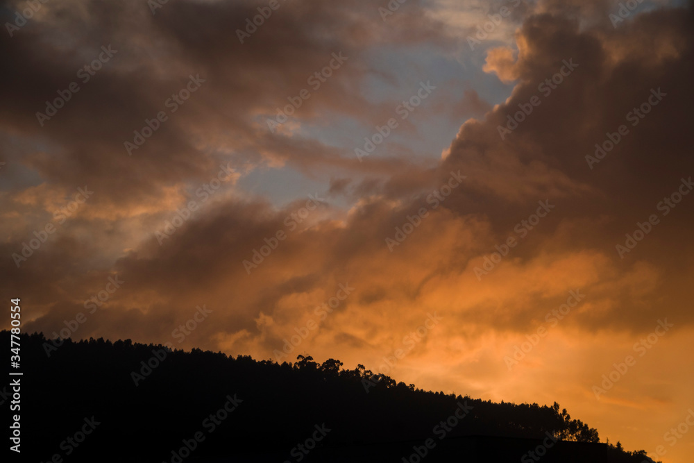 Mountain sunset with colourful clouds