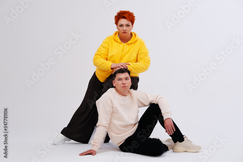 Studio portrait of funny couple posing 