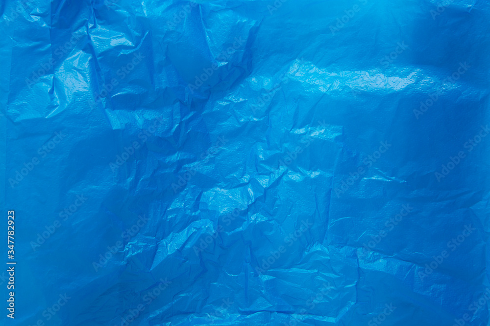 Blue wrinkled plastic bag texture background. Blue wrinkled plastic bag texture background.