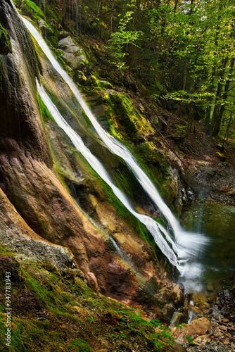 Rehbach waterfall (near Schattwald, Tyrol, Austria) in springtime photo