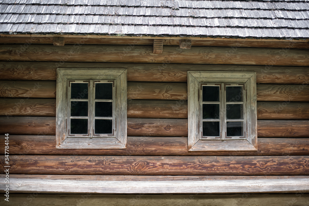 Old wood frame house with two Windows. House in countryside. Rustic. Old wood frame house with two Windows. House in countryside. Rustic.