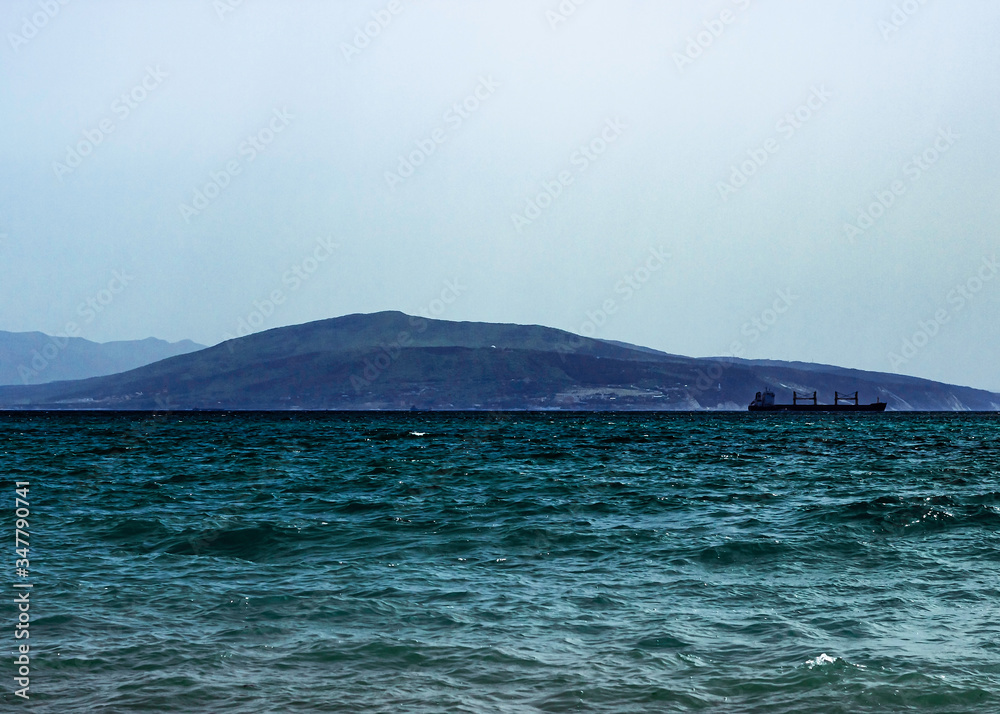 Sunny day in the sea coastline. Rest on the black sea. Tsemess Bay. Novorossiysk bay.