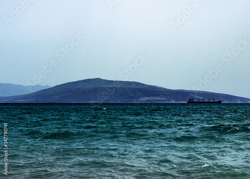 Sunny day in the sea coastline. Rest on the black sea. Tsemess Bay. Novorossiysk bay. photo