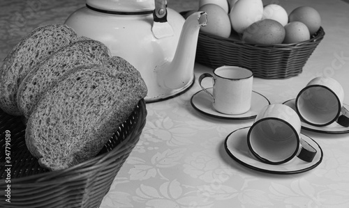 A table arrangement with, teapot, breads and cookies photo