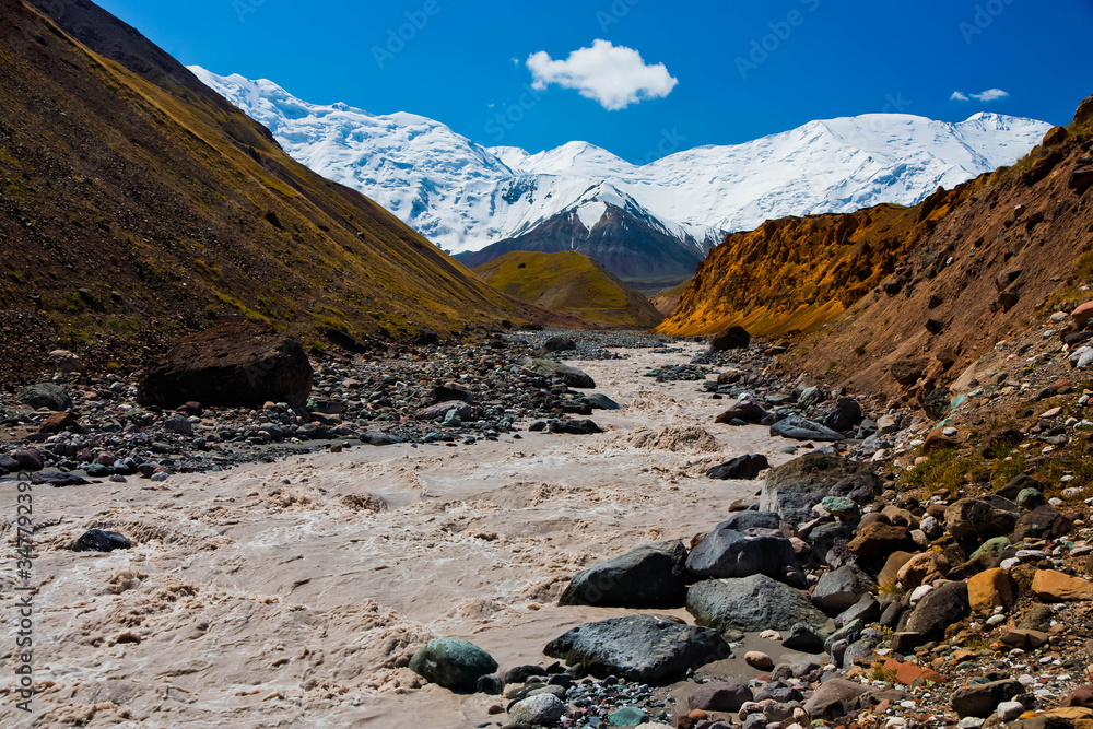 Beautiful landscape. Hilly area. The sandy gorge. Mountainious terrain. Snowy peaks. Beautiful landscape. Hilly area. The sandy gorge. Mountainious terrain. Snowy peaks.