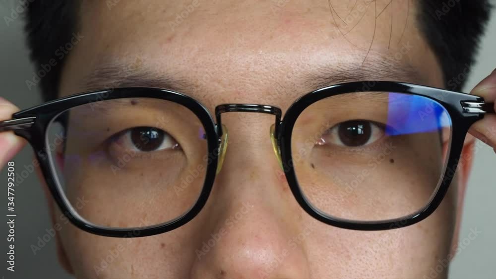 Man taking off eye glasses close up Man taking off eye glasses close up