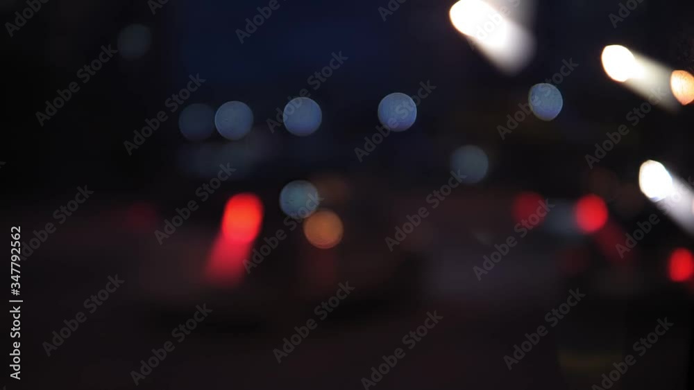 Defocus of road traffic at night. Blurrred lights of city and car head lamps Defocus of road traffic at night. Blurrred lights of city and car head lamps