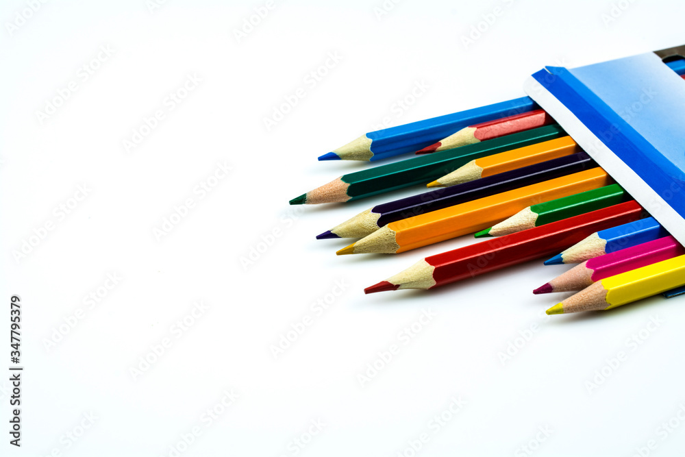 Fototapeta premium Colored pencils in a box isolated on a white background.
