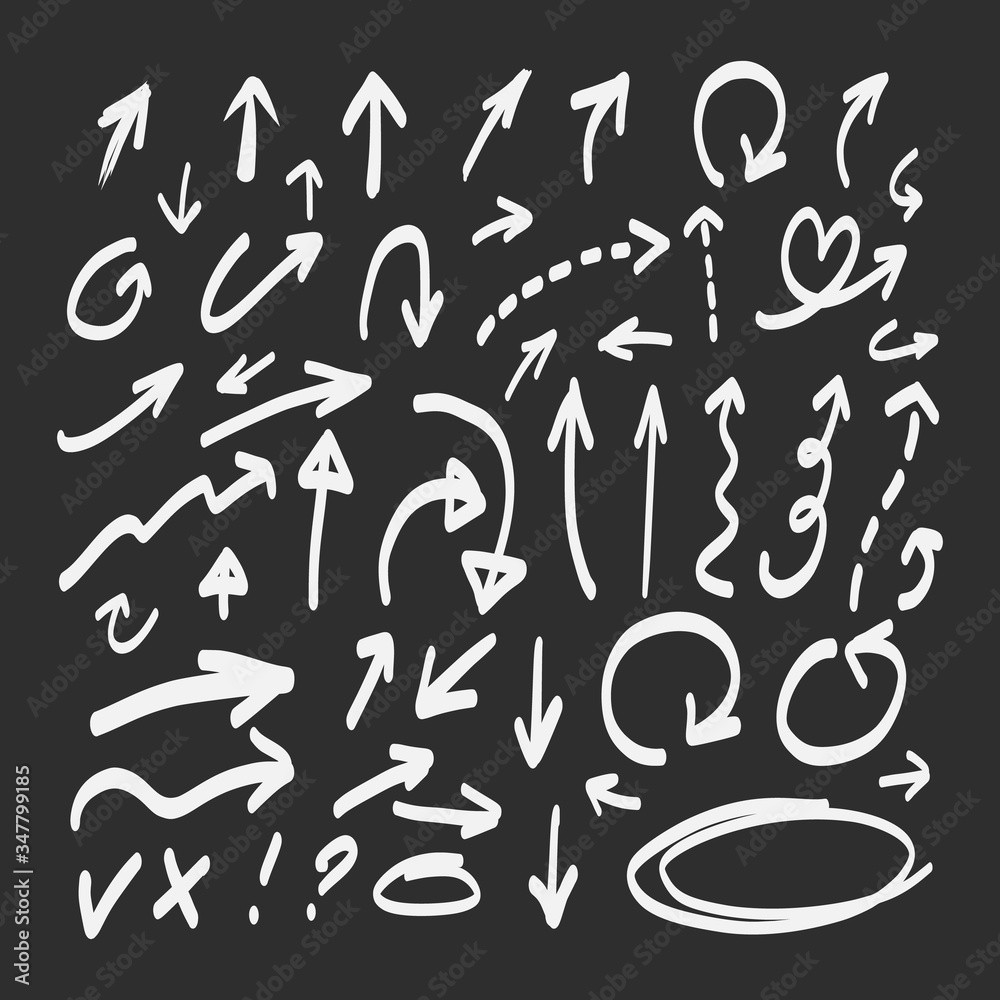 Hand drawn doodle arrows set on a blackboard background Hand drawn doodle arrows set on a blackboard background