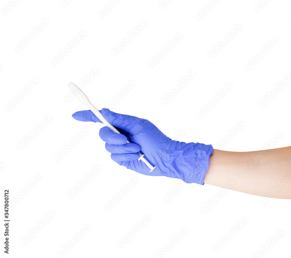 Tablet with an applicator in the hand of a nurse on a white background Tablet with an applicator in the hand of a nurse on a white background