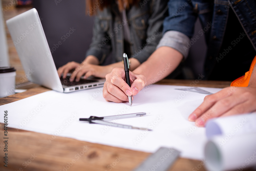 Image of engineer meeting for architectural project. working with partner and engineering tools on workplace vintage tone. Image of engineer meeting for architectural project. working with partner and engineering tools on workplace vintage tone.