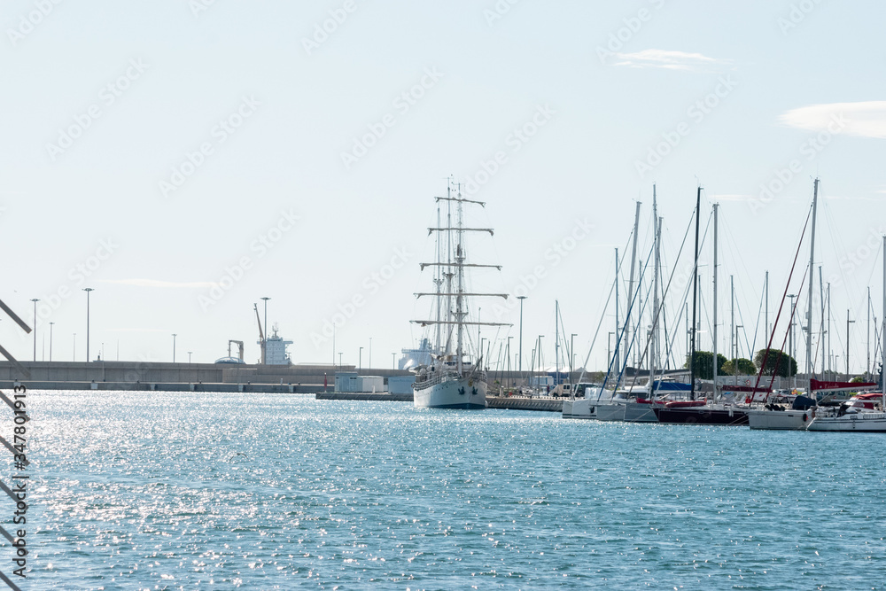 The yacht, and  sailing  large ship in port