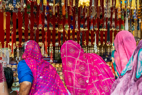 Women do shopping at market at Pushkar Camel Fair, Pushkar, Rajasthan / India - November 9,2019