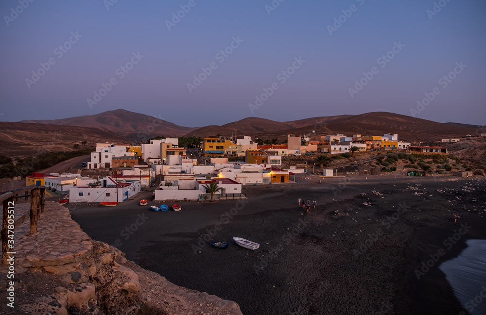 Small village Ajuy on the Atlantic coast at sunset, Fuerteventura Island, Canary Islands, Spain. October 2019