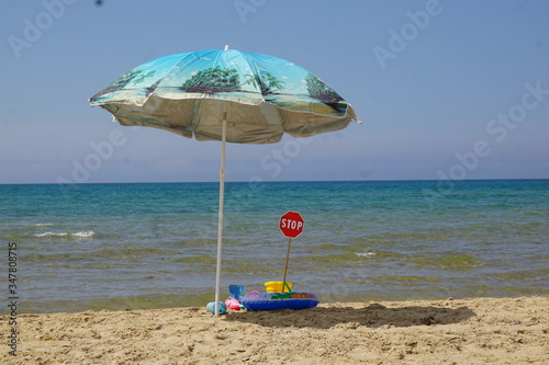 Stop sign on the beach. Quarantine. Public areas are closed to visitors due to coronavirus.