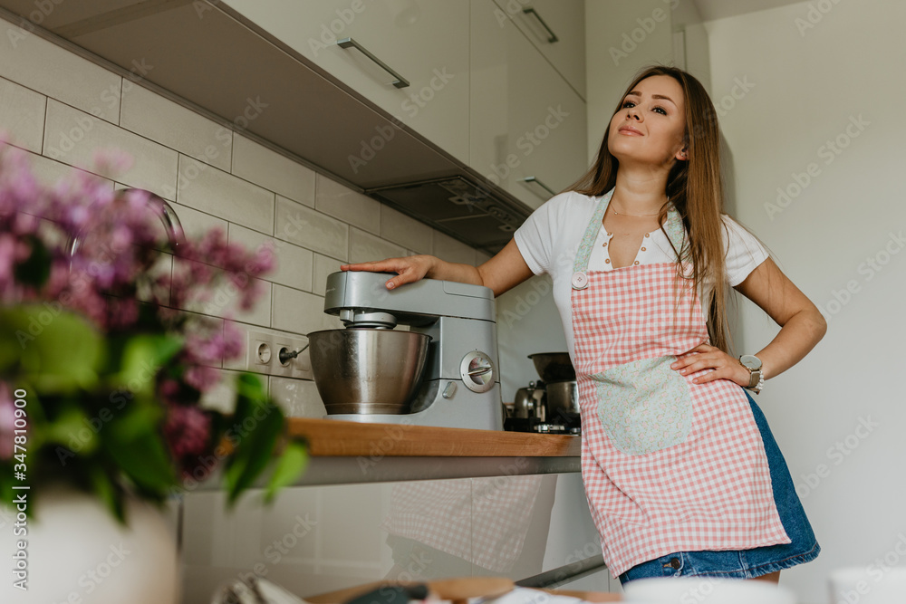 Young Woman Cooking in the kitchen. Healthy Food. Dieting Concept. Healthy Lifestyle. Cooking At Home. Prepare Food