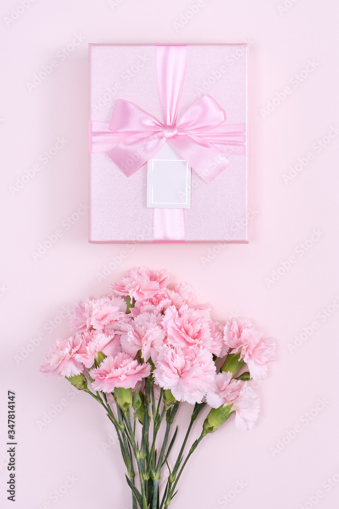 Mother's Day, Valentine's Day background design concept, beautiful pink carnation flower bouquet on pastel pink table, top view, flat lay, copy space. Mother's Day, Valentine's Day background design concept, beautiful pink carnation flower bouquet on pastel pink table, top view, flat lay, copy space.
