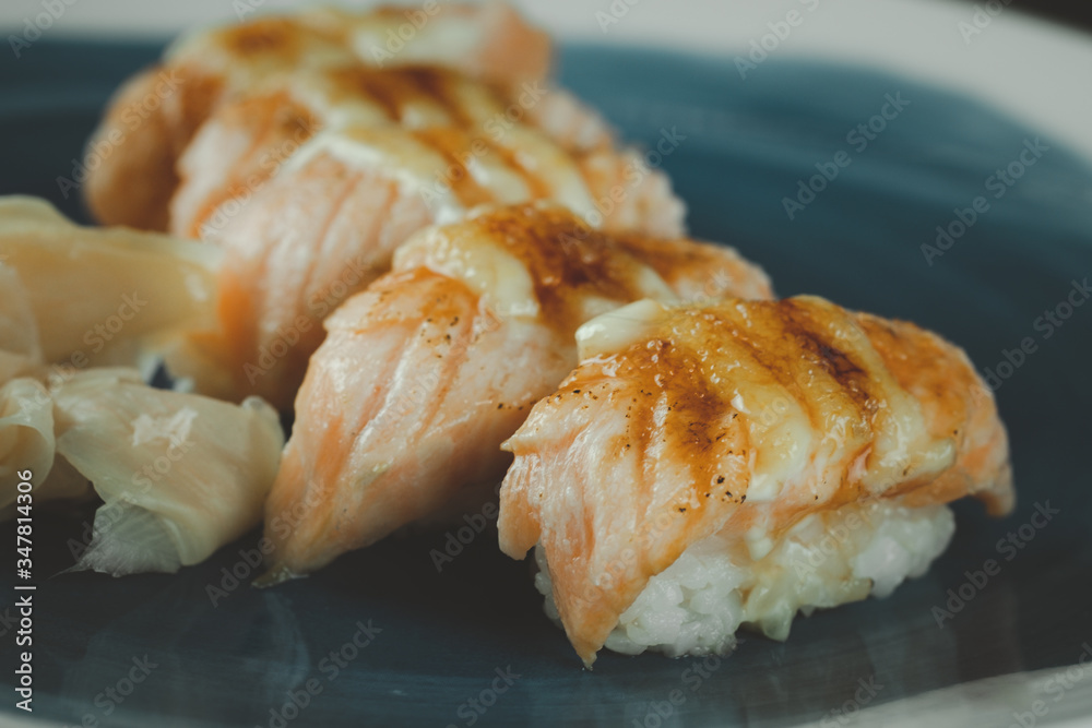 Burn of salmon sushi. Selective focus Burn of salmon sushi. Selective focus