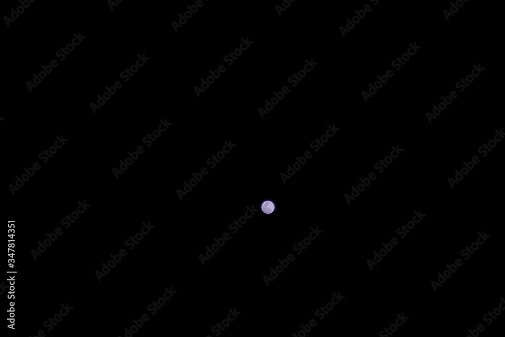 Full moon over the black sky at night Full moon over the black sky at night