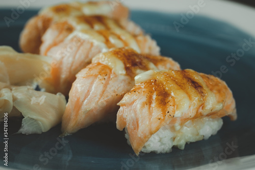 Burn of salmon sushi. Selective focus