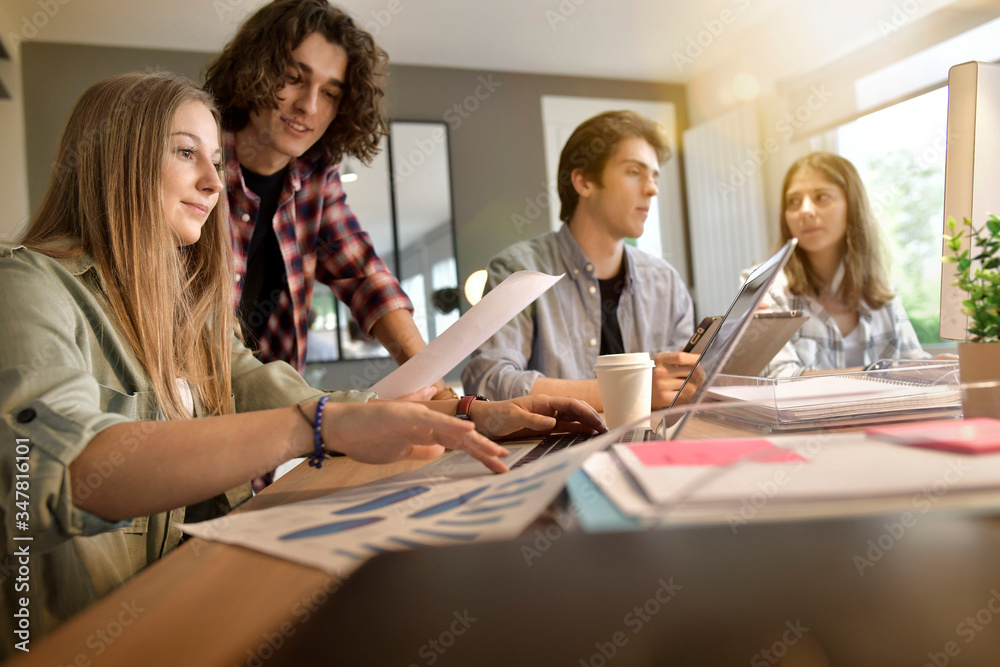 Group of students working together on project Group of students working together on project