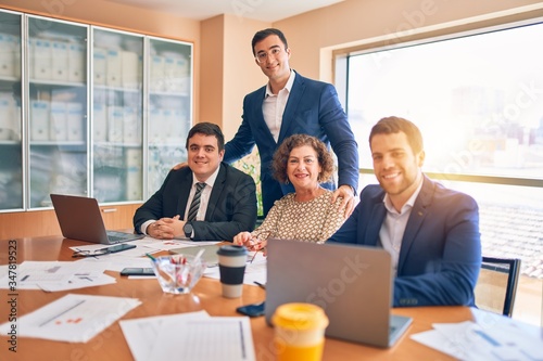 Business lawyers workers meeting at law firm office. Professional executive partners working on finance strategry at the workplace. Smiling happy and cofident to the camera. photo