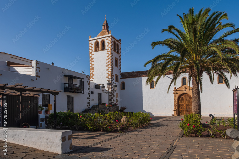 Central square with church tower in Betancuria village on Fuerteventura island in Spain. October 2019