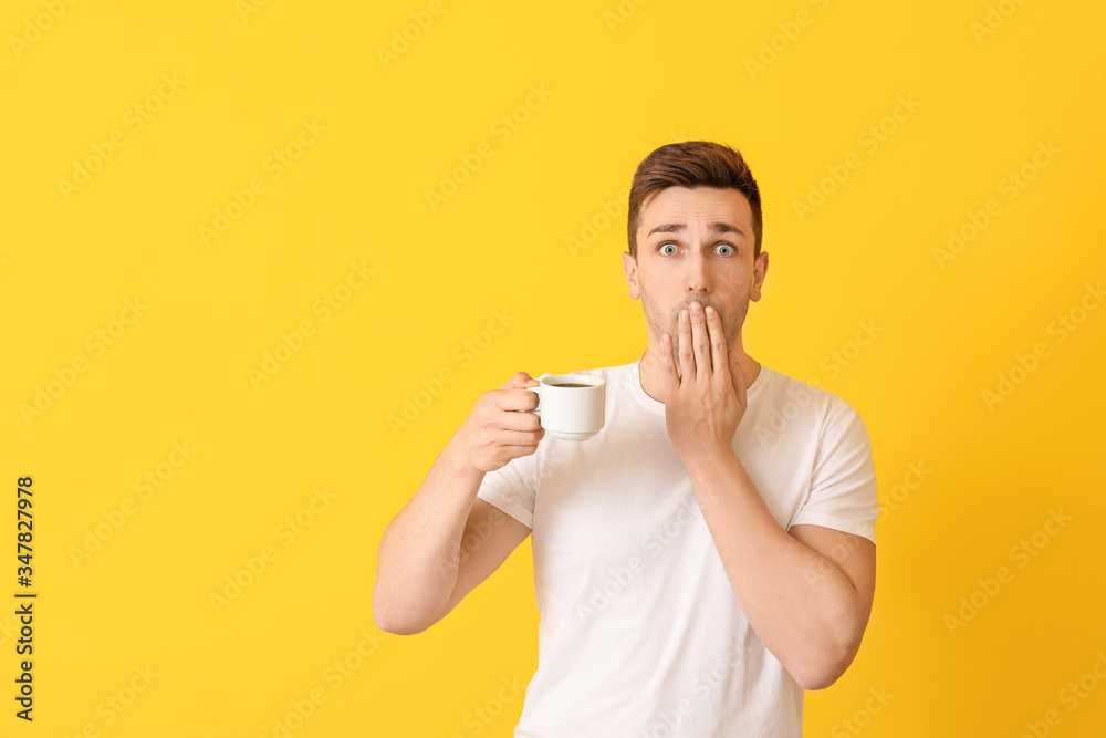 Shocked man with coffee on color background Shocked man with coffee on color background