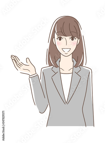 笑顔で手を差し出す正面向きの女性