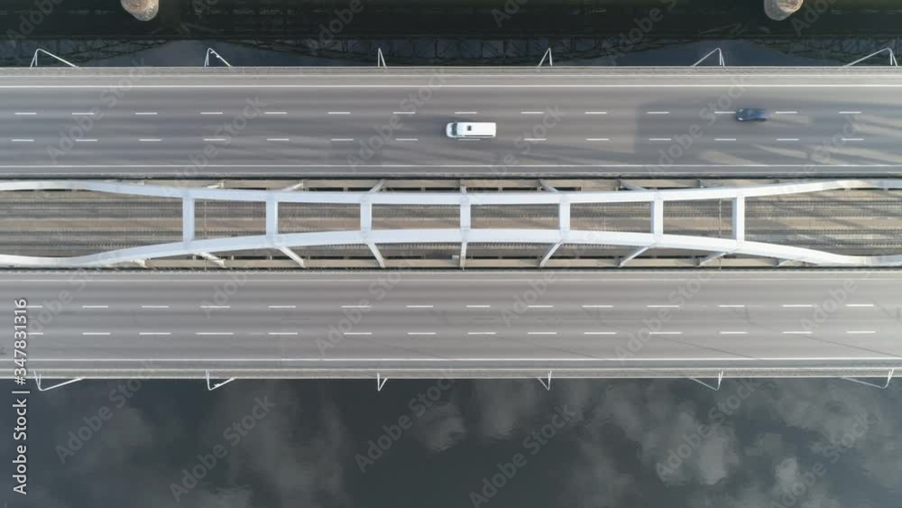 Aerial top down view. Cars moves on almost empty modern bridge. 4K Aerial top down view. Cars moves on almost empty modern bridge. 4K