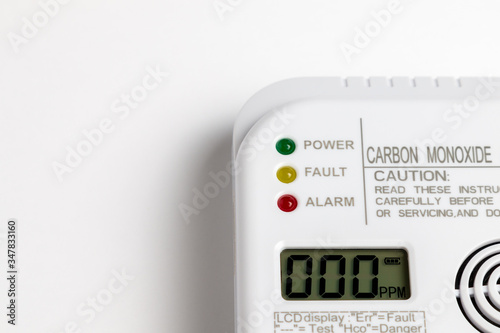 Carbon monoxide detector on a white wall. Stay home safe. Home control and security.  CO detector photo
