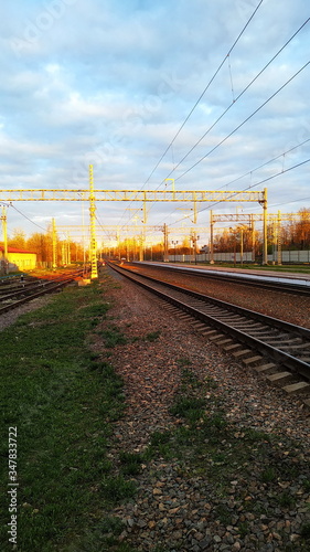 railway in spring at sunset in the countryside