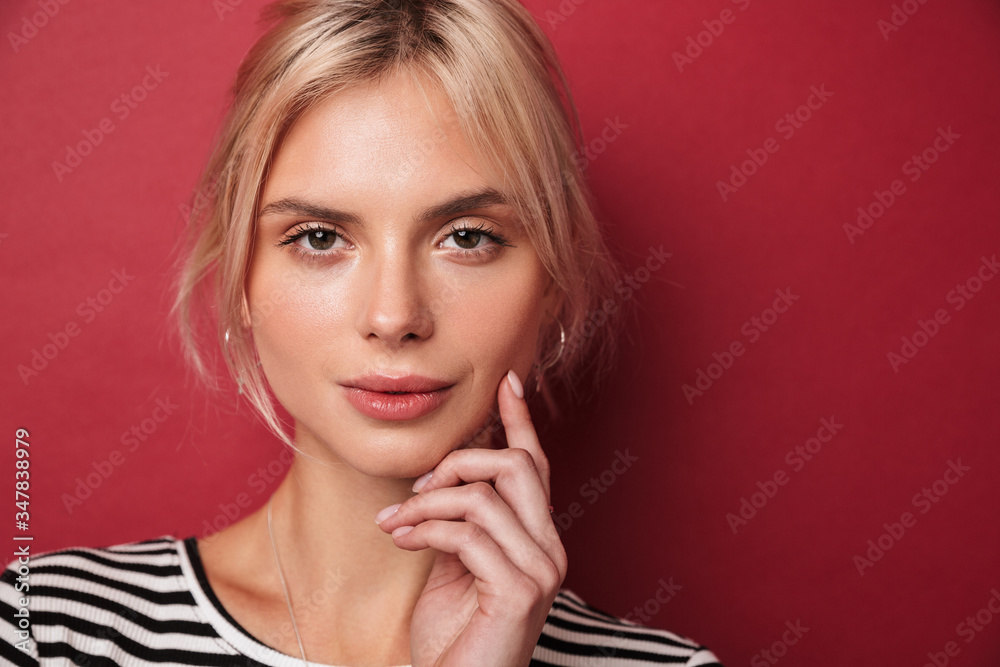 Image of beautiful blonde woman posing and looking at camera Image of beautiful blonde woman posing and looking at camera