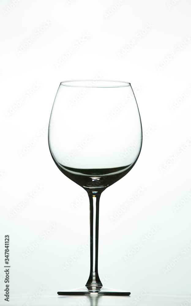 Empty wine glass on a white background