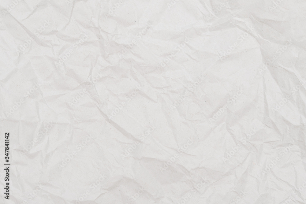 White crumpled paper texture background. Close-up. White crumpled paper texture background. Close-up.