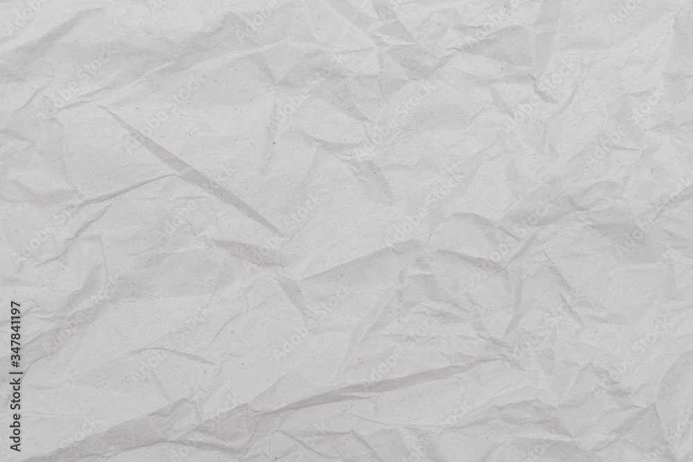 Obraz premium White crumpled paper texture background. Close-up.