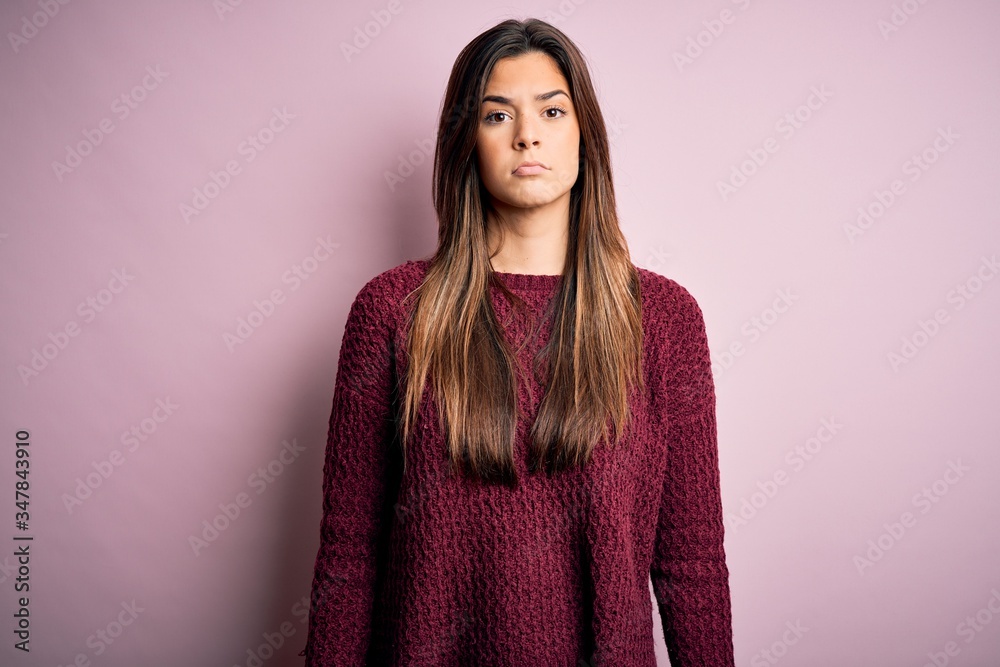 Fototapeta premium Young beautiful girl wearing casual sweater over isolated pink background depressed and worry for distress, crying angry and afraid. Sad expression.