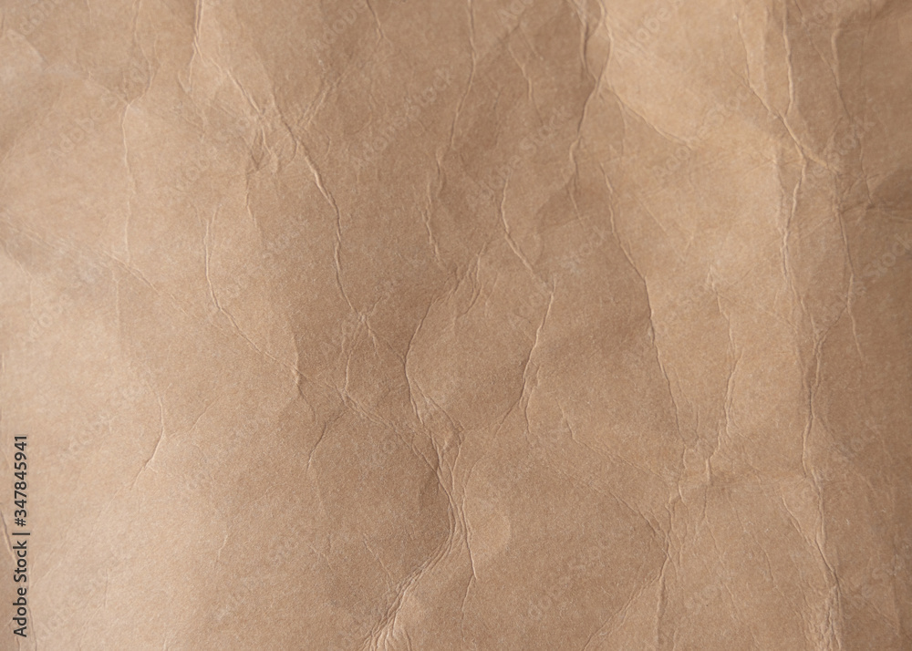 Obraz premium Brown crumpled paper texture background.