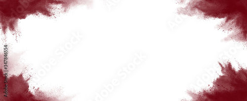splashes of maroon red paint, scattered dry powder pigment on a white background. coloristics photo