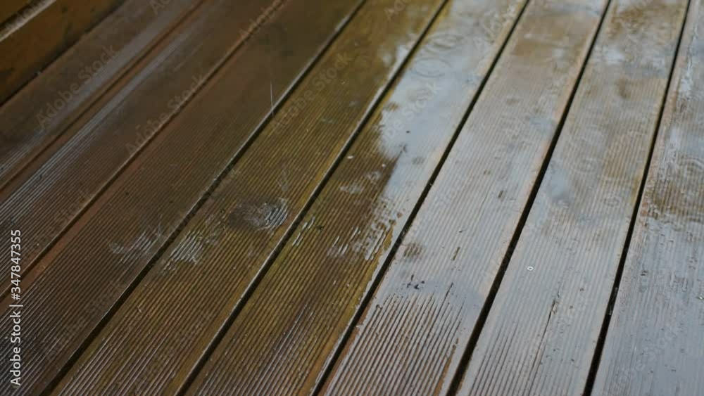 Raindrops on brown wooden terrace planks Raindrops on brown wooden terrace planks