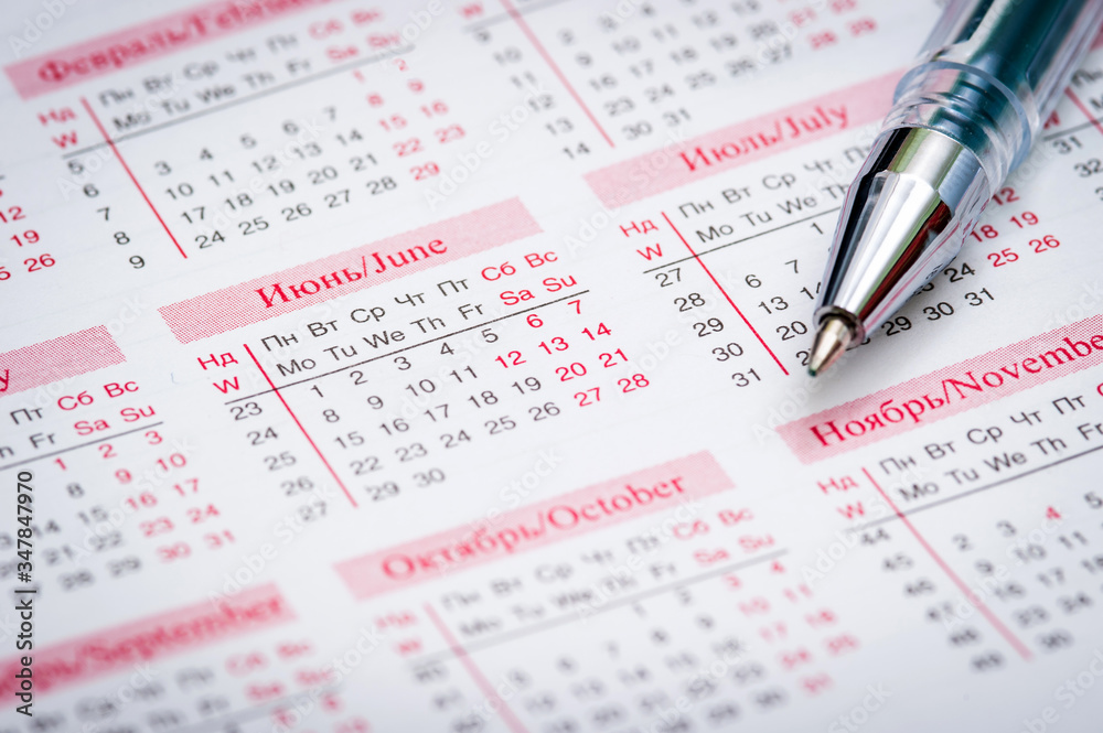 Calendar with pink months and pen, June. Calendar with pink months and pen, June.