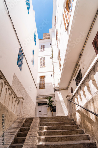 Tanger white street medina stairs © juliaggmm
