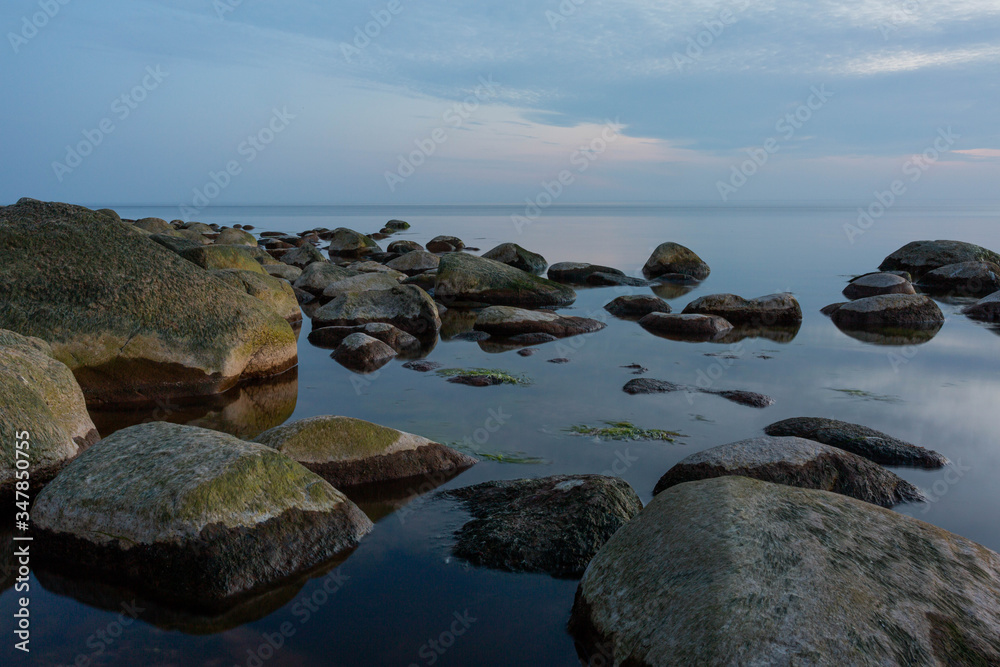 City Tuja, Latvia. Baltic sea with rocks and sunshine. Travel photo. City Tuja, Latvia. Baltic sea with rocks and sunshine. Travel photo.