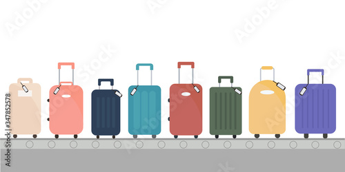 Multicolor luggage, suitcase, bags on conveyor belt in airport terminal.