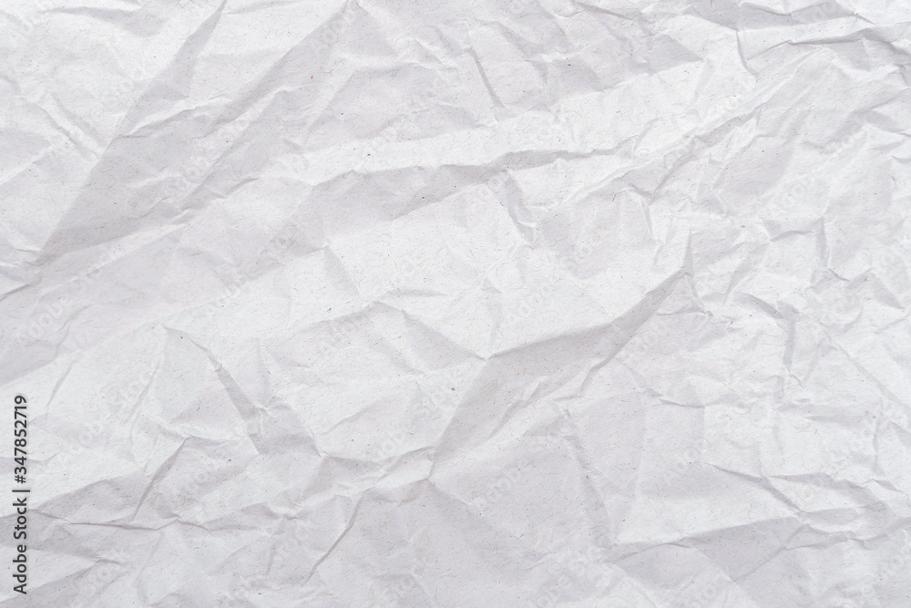 White crumpled paper texture. Abstract paper pattern for background. Close-up. White crumpled paper texture. Abstract paper pattern for background. Close-up.