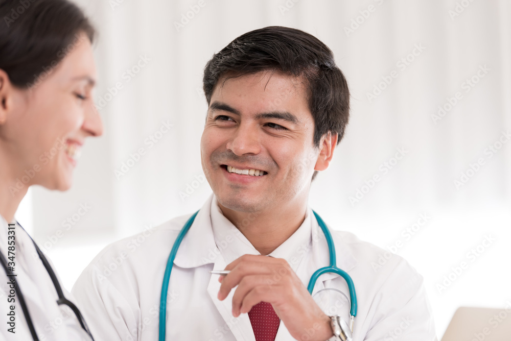 Two doctors have working together with happiness in the hospital. Two doctors have working together with happiness in the hospital.