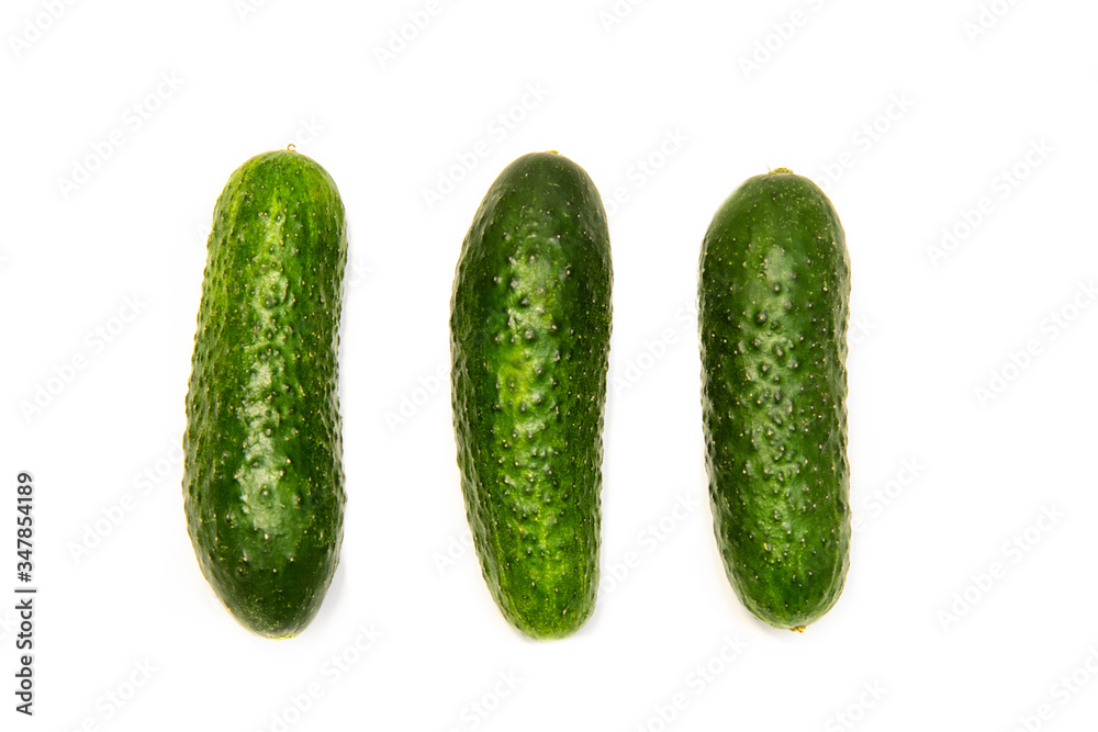 Three cucumbers on a white background Three cucumbers on a white background