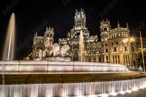 night photograpy of Cybele Palace and fountain in the foreground madrid